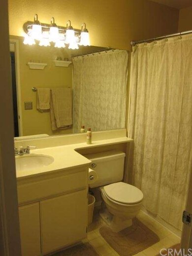 Guest Bathroom has stand up shower with bathtub.  