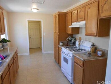 View #2 of kitchen with new stove.
