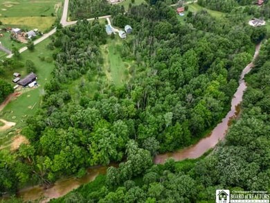 aerial view of property with Big Sister Creek