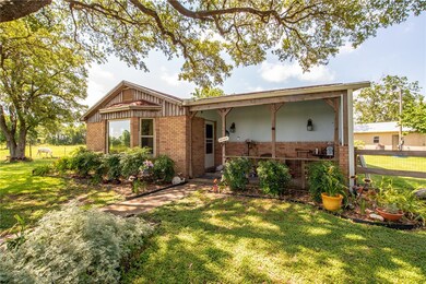 Single story home with brick siding