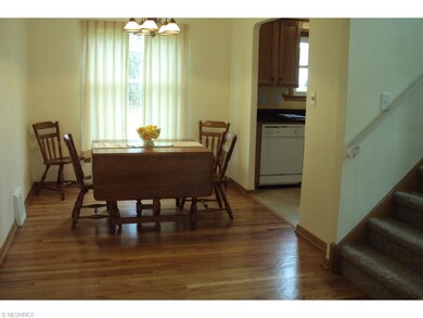 Spacious dining room with gleaming hardwood floors