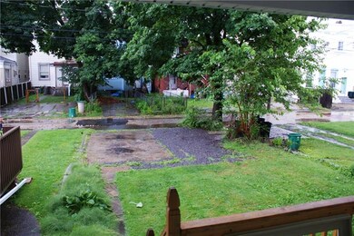 Off-street parking pad for two tenants, the third 