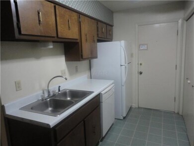Kitchen with Refrigerator & Dishwasher & Vinyl