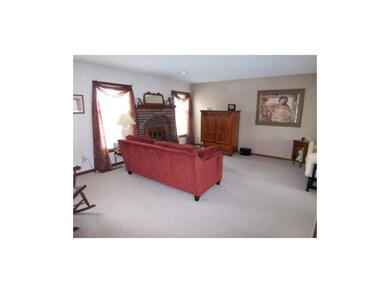 Large living room features one of the two fireplac