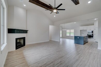 Unfurnished living room featuring light hardwood /