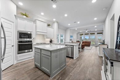 Light and bright Kitchen with island, recessed lig