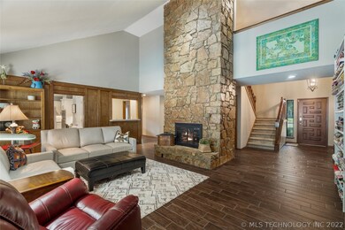 DRAMATIC FLOOR TO CEILING STONE FIREPLACE WITH GAS
