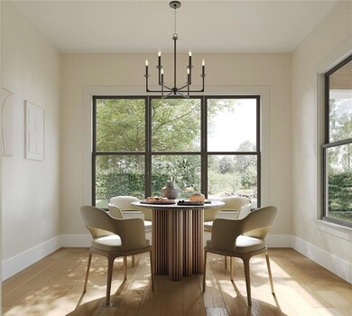 Dining area featuring a chandelier, plenty of natural light, and light wood-style flooring