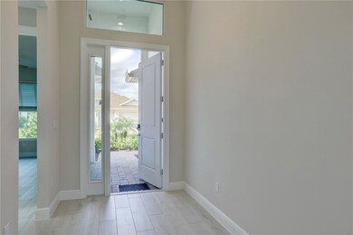 Entryway with baseboards and wood finished floors