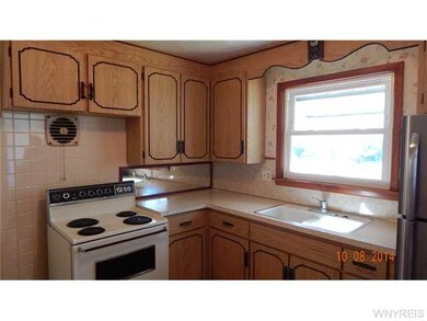 Kitchen Dining. Plenty of real wood cabinets in th