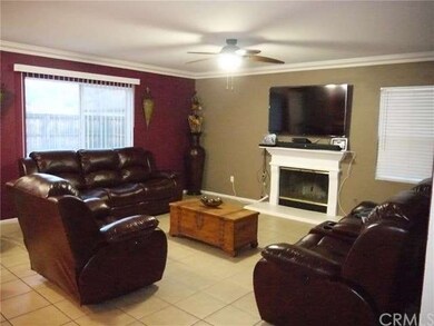 LIVING ROOM WITH CEILING FAN AND FIREPLACE