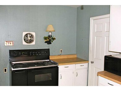 Kitchen. Formal dining room off...