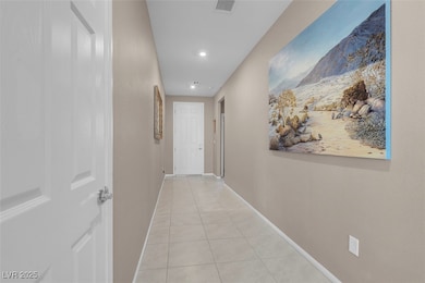 Hall featuring light tile patterned flooring, base