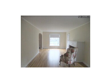 The spacious living room is located to the left of