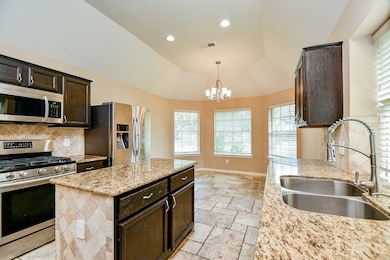 Island, pantry (left of the range), gas range and