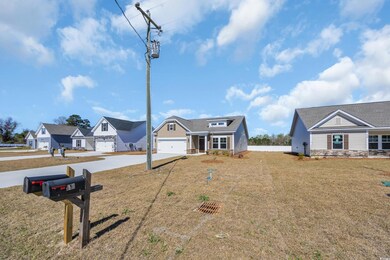View of front of home with a front lawn, stone sid