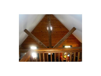 Rustic beams accent the great A-frame floor plan
