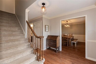 Foyer leads to formal dining area.