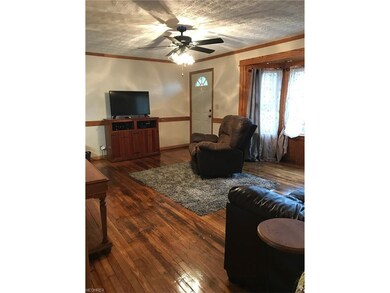 Amazing livingroom with refinished floors.