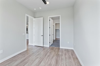 Unfurnished bedroom featuring light wood-type flo