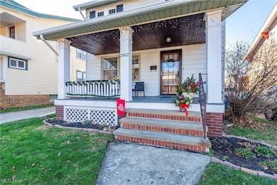 View of exterior entry featuring a porch