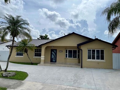 FRONT VIEW AND DRIVEWAY