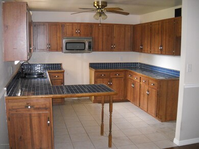 Kitchen view with small breakfast bar