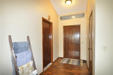 Welcoming foyer with coat closet. There is an encl