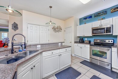 Kitchen with decorative light fixtures, stainless 