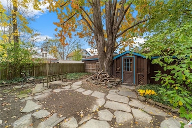 Fenced backyard with a shed