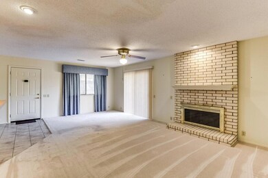 The focal point of the living room is the brick wo