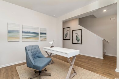 Home office featuring hardwood / wood-style floori