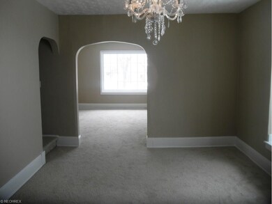 Dining Room has new carpeting, chandelier and fresh paint