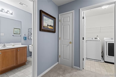 Laundry room featuring washer and clothes dryer an
