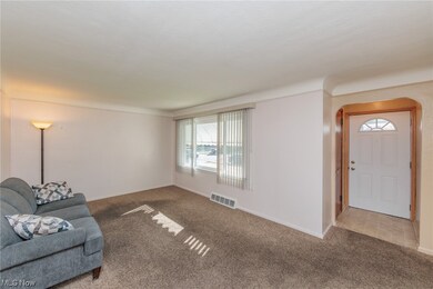 Unfurnished living room with carpet flooring