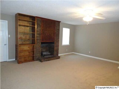 GREATROOM HAS BRICK FIREPLACE/GASLOGS AND BUILT IN BOOKSHELVES.