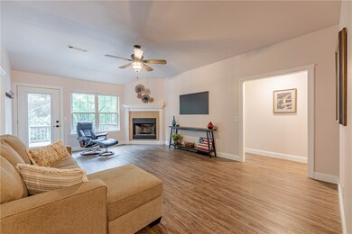 Corner fireplace anchors a wonderful Living Room.