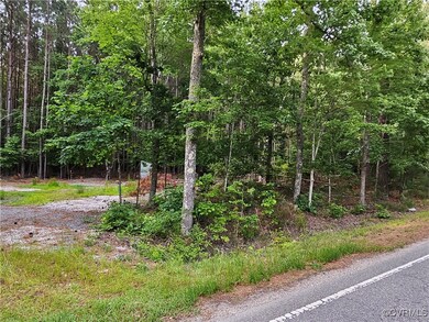 View of asphalt street with a view of trees
