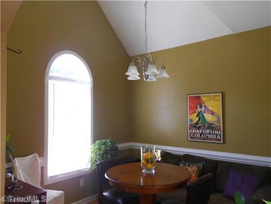 Dining Room. Arched window, chair rail and a vaulted ceiling really add s interest to this room.