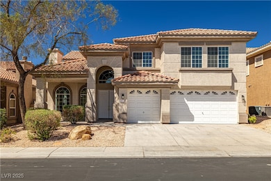 View of front of home featuring a tiled roof, stuc
