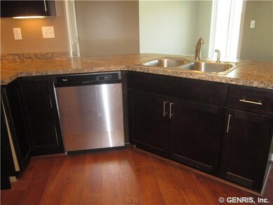 Kitchen Java stained maple cabinets with stainless