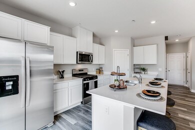 The appliance package included in the home features a stainless steel gas range, vented microhood, and dishwasher - all of which is surrounded by a stunning finish to a space you'll love spending time in.  Image is of model, colors may vary.