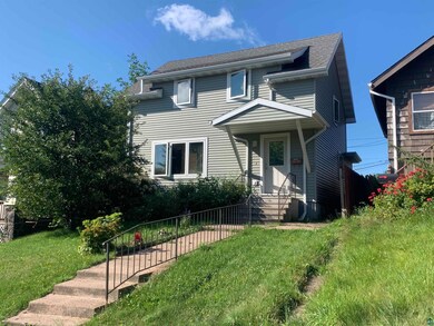 View of front of house featuring central AC unit a