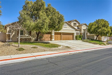 View of front of house with stucco siding, drivewa