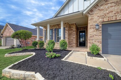 Elegant home with charming brick exterior and beautifully landscaped.