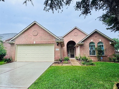 This charming brick home features a two-car garage