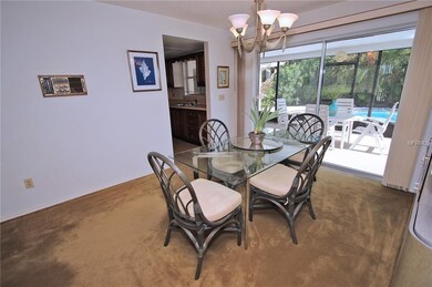 Dining area with sliders to patio and pool area