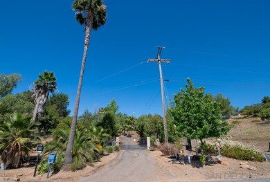 Gated driveway with electric fence.