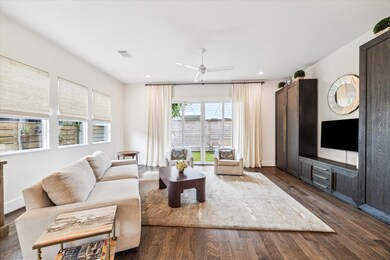 Bright and spacious living room with hardwood floo