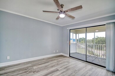 Empty room with crown molding, hardwood / wood-sty